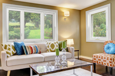Inspiration for a transitional dark wood floor and brown floor living room remodel in Chicago with yellow walls