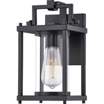 Quoizel - Quoizel Garrett 6.5" 1 Light Outdoor Wall Lantern, Black/Clear - The Garrett collection will instantly enhance the exterior of your home. The minimalist design with clean, thin lines creates a modern look that you and your guests are sure to enjoy. The open frame is crafted from steel, finished in Matte Black and contains a clear cylindrical glass shade for a unique design element.