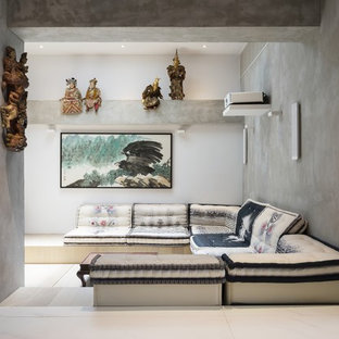 Photo of a contemporary open plan home cinema in Hong Kong with grey walls and white floors.