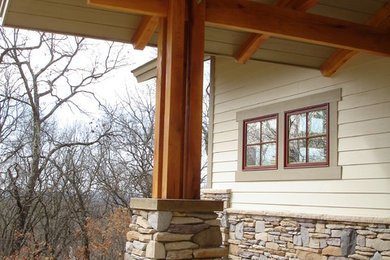 Mid-sized arts and crafts exterior home photo in Other