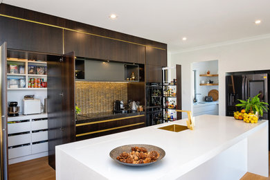 Moody kitchen with brass negative detailing