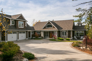 Inspiration for a large craftsman brown two-story wood exterior home remodel in Other with a shingle roof