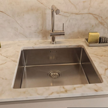 Marble Backsplash and Minimalist Sink Design