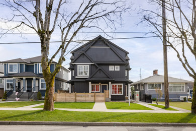 Inspiration for a craftsman three-story concrete fiberboard and board and batten exterior home remodel in Vancouver with a shingle roof and a black roof