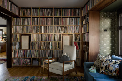 Family room - enclosed medium tone wood floor and wallpaper family room idea in Seattle with a music area and no fireplace