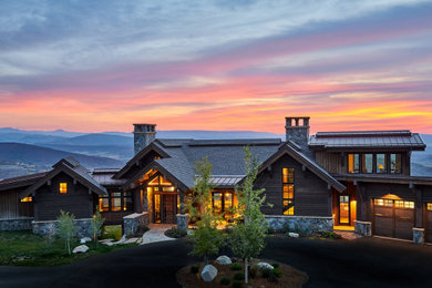 Example of a mountain style house exterior design in Denver