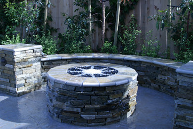 Mid-sized transitional backyard concrete patio photo in Dallas with a fire pit and no cover