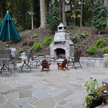 Chocolate Grey Outdoor Fireplace and Seating wall with Pennsylvania Blue Patio