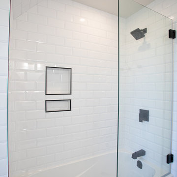 A Bathroom Renovation Brings Light Over Every Clean Lined Tile