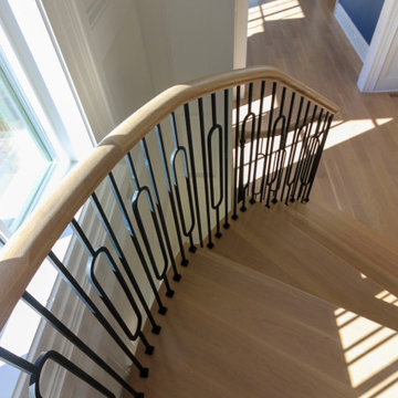 Project #95 | Freestanding Elliptical Staircase with Geometric Iron Balusters