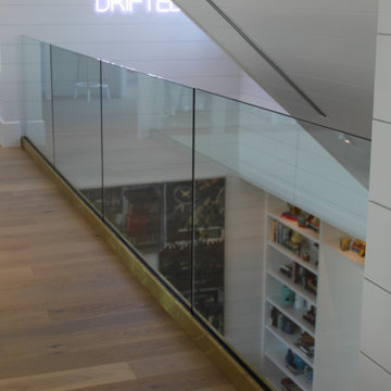 Glass Balustrade with Aluminum Base Rail Finished with Satin Brass Cladding