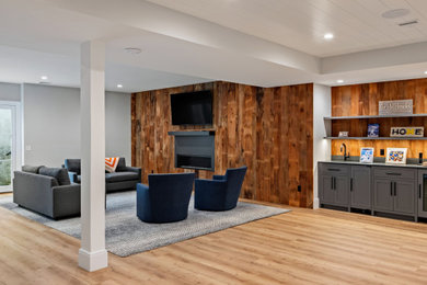 Inspiration for a contemporary walk-out basement remodel in New York with a home theater
