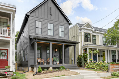 Photo of a mid-sized modern two-storey black house exterior in Richmond with concrete fiberboard siding, a gable roof, a shingle roof, a black roof and clapboard siding.