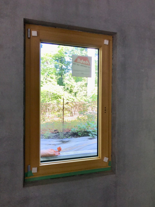 Window Trim Modern And Concrete The Standard Installation Method Is To Pound A Strap Into Frame And Have It Stick Out Inside Of House Secure Side
