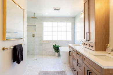 Inspiration for a mid-sized modern master yellow tile and marble tile marble floor, white floor and double-sink bathroom remodel in New York with shaker cabinets, brown cabinets, a two-piece toilet, white walls, an undermount sink, quartzite countertops, white countertops and a freestanding vanity