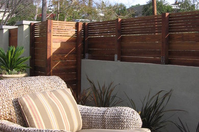 This is an example of a modern courtyard outdoor basketball/tennis/multi-game court in San Francisco with decking.