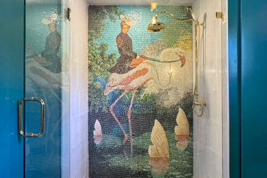 Mid-sized arts and crafts marble floor, white floor, single-sink and wallpaper alcove shower photo in Los Angeles with furniture-like cabinets, brown cabinets, a one-piece toilet, blue walls, a vessel sink and a hinged shower door
