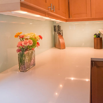 Seaside inspired Kitchen with custom Back painted glass backsplash and cabinets