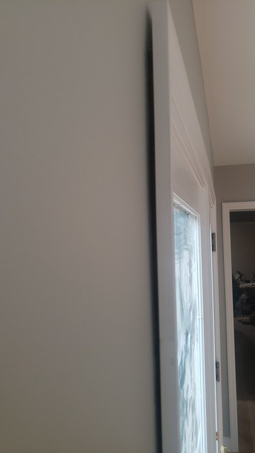 Window and door casing not flush with wall