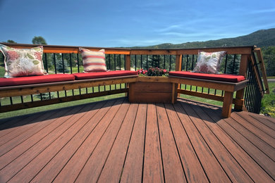 Example of a mid-sized arts and crafts backyard deck design in Denver with no cover