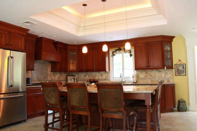 Example of a classic l-shaped kitchen design in New York