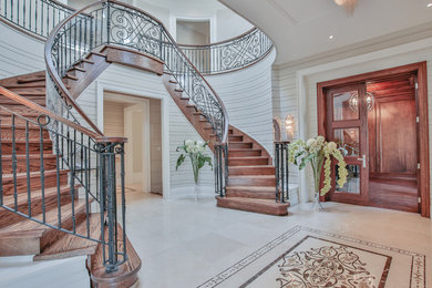 Large transitional marble floor entryway photo in Toronto with gray walls
