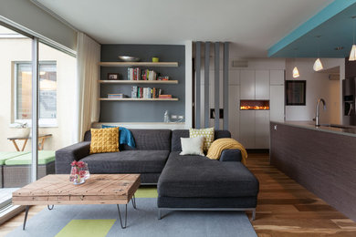 Inspiration for a transitional formal medium tone wood floor living room remodel in Vancouver with white walls
