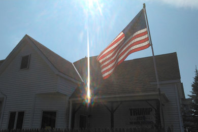 Example of an arts and crafts exterior home design in New York