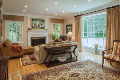 Example of a mid-sized classic formal and enclosed light wood floor living room design in Other with no tv, beige walls, a standard fireplace and a plaster fireplace