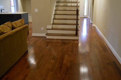 Design ideas for a large traditional hallway in Atlanta with beige walls and dark hardwood floors.