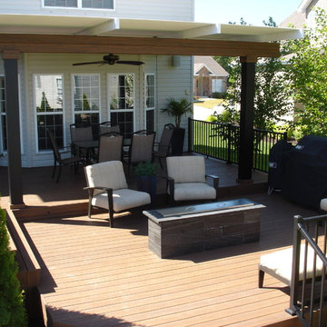 Deck with louvered roof, fire feature, and inset hot tub - Dardenne Prairie, MO