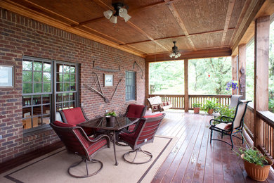 Large arts and crafts back porch photo in Birmingham with decking and a roof extension