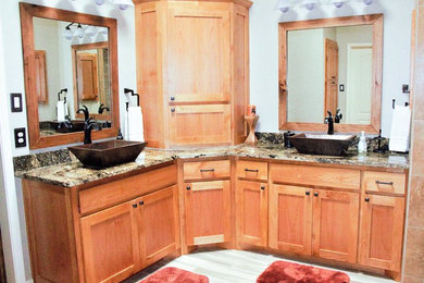 Design ideas for a large arts and crafts master bathroom in Dallas with shaker cabinets, brown cabinets, a drop-in tub, an open shower, a one-piece toilet, beige tile, ceramic tile, beige walls, ceramic floors, a vessel sink, granite benchtops, beige floor and an open shower.