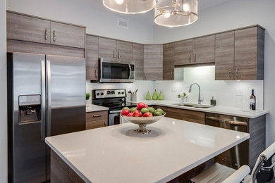 Inspiration for a modern l-shaped eat-in kitchen remodel in Other with an island