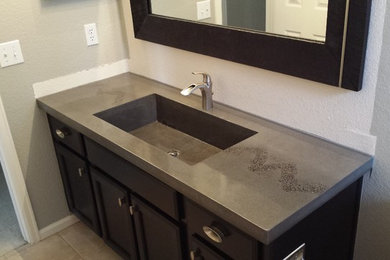 Bathroom - contemporary 3/4 bathroom idea in Denver with an integrated sink, black cabinets and concrete countertops
