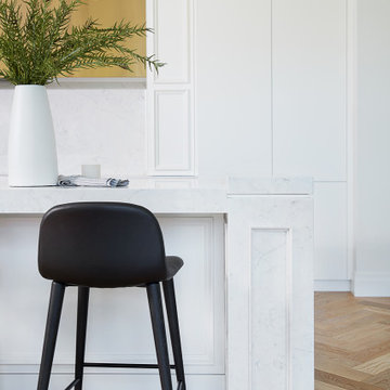 Sleek, White, Quartz-Embellished Kitchen