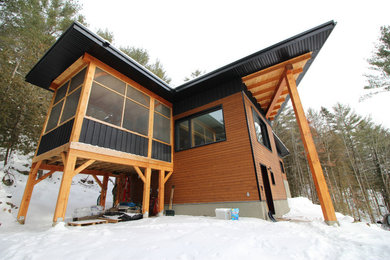 Inspiration for a huge craftsman multicolored two-story wood flat roof remodel in Ottawa