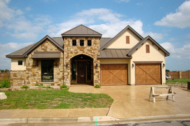 Mid-sized rustic beige two-story mixed siding gable roof idea in Austin