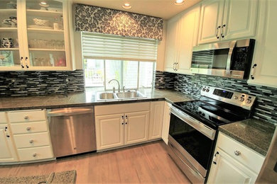 Kitchen photo in Seattle with multicolored backsplash