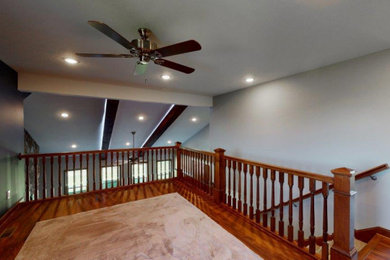 Inspiration for a mid-sized craftsman loft-style vinyl floor family room remodel in Cleveland