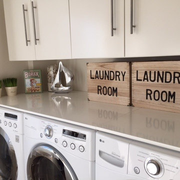 Super efficient 2 Washer and Dryer Laundry Room.