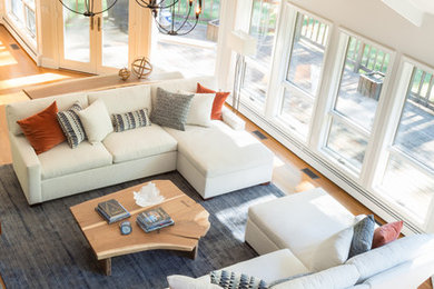 Example of a large transitional open concept medium tone wood floor living room design in Providence with beige walls