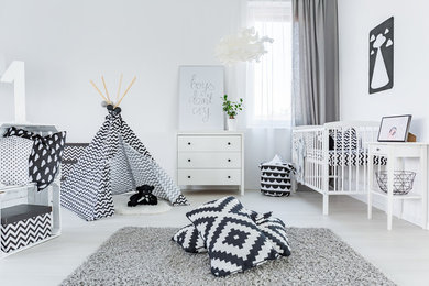 Example of a minimalist kids' room design in Other