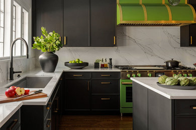 Eat-in kitchen - large transitional u-shaped dark wood floor and brown floor eat-in kitchen idea in New York with an undermount sink, recessed-panel cabinets, black cabinets, quartzite countertops, white backsplash, quartz backsplash, paneled appliances, an island and white countertops