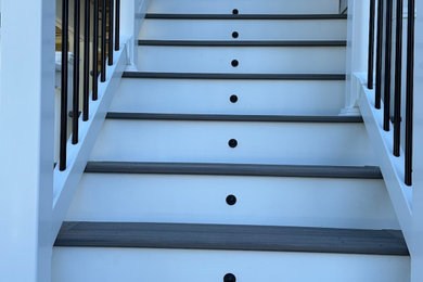 Mid-sized minimalist backyard second story mixed material railing deck photo in Philadelphia