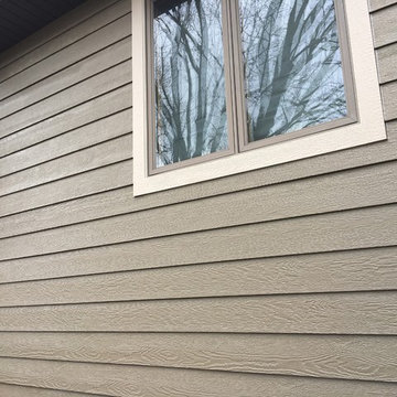 Diamond Kote siding, aluminum Dark bronze soffit and gutters