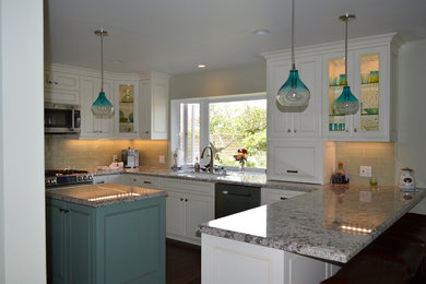 Large transitional u-shaped dark wood floor and brown floor eat-in kitchen photo in Los Angeles with an undermount sink, raised-panel cabinets, white cabinets, granite countertops, gray backsplash, glass tile backsplash, stainless steel appliances and an island