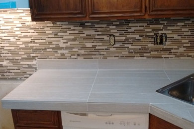 Kitchen remodel: new countertop, backsplash, floor, & fixtures.