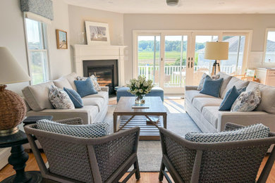 Example of a beach style living room design in Boston