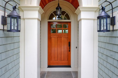Inspiration for a mid-sized timeless slate floor entryway remodel in Bridgeport with green walls and a medium wood front door